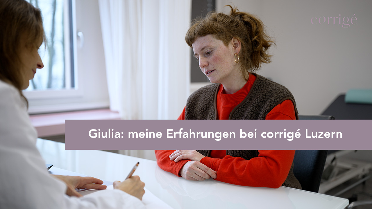 Eine Frau in einem roten Pullover sitzt einem Fachmann in einem Büro gegenüber. Der Text darüber lautet: "Giulia: meine Erfahrungen bei corrigé Luzern.